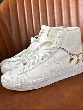 Nike Women’s High-Top Sneakers in White with Gold Charm